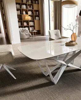 Jedálenské stoly DELIFE Jedálenský stôl Edge zaoblený tvar 200x100 cm keramika onyx champagne spider kov biela