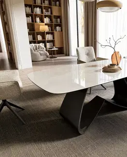 Jedálenské stoly DELIFE Jedálenský stôl Edge zaoblený tvar 200x100 cm keramika onyx šampanské podstava v tvare W kov čierna