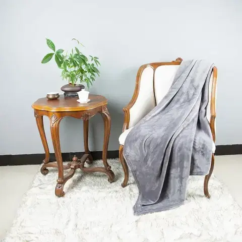 Ozdobné prikrývky Deka Laguna 70x140cm sivý