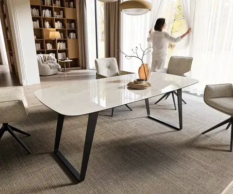 Jedálenské stoly DELIFE Jedálenský stôl Edge zaoblený tvar 200x100 cm keramika onyx šampanské kov šikmý čierna