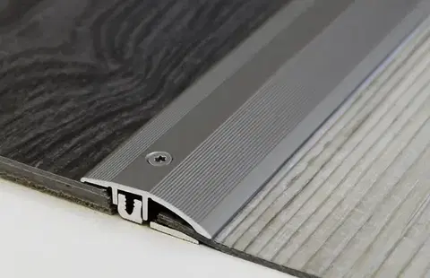 Přechodové lišty a profily Prechodový spojovací profil 33 mm pre krytiny do 9,5 mm (skrutkovací) | nivelácia 4 - 12 mm Stříbro F4