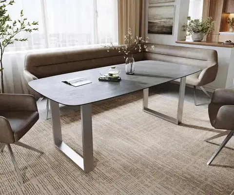 Jedálenské stoly DELIFE Jedálenský stôl Edge zaoblený 200x100 cm keramika betónová sivá nerezová oceľ úzky