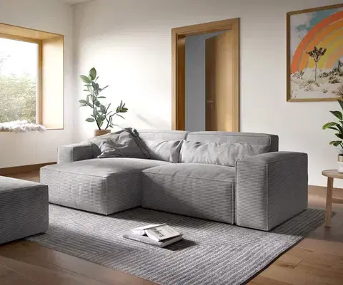 Rohové sedacie súpravy DELIFE Rohová pohovka Sirpio XL 270x170 cm manšester strieborno sivá variabilné ležadlo s taburetom